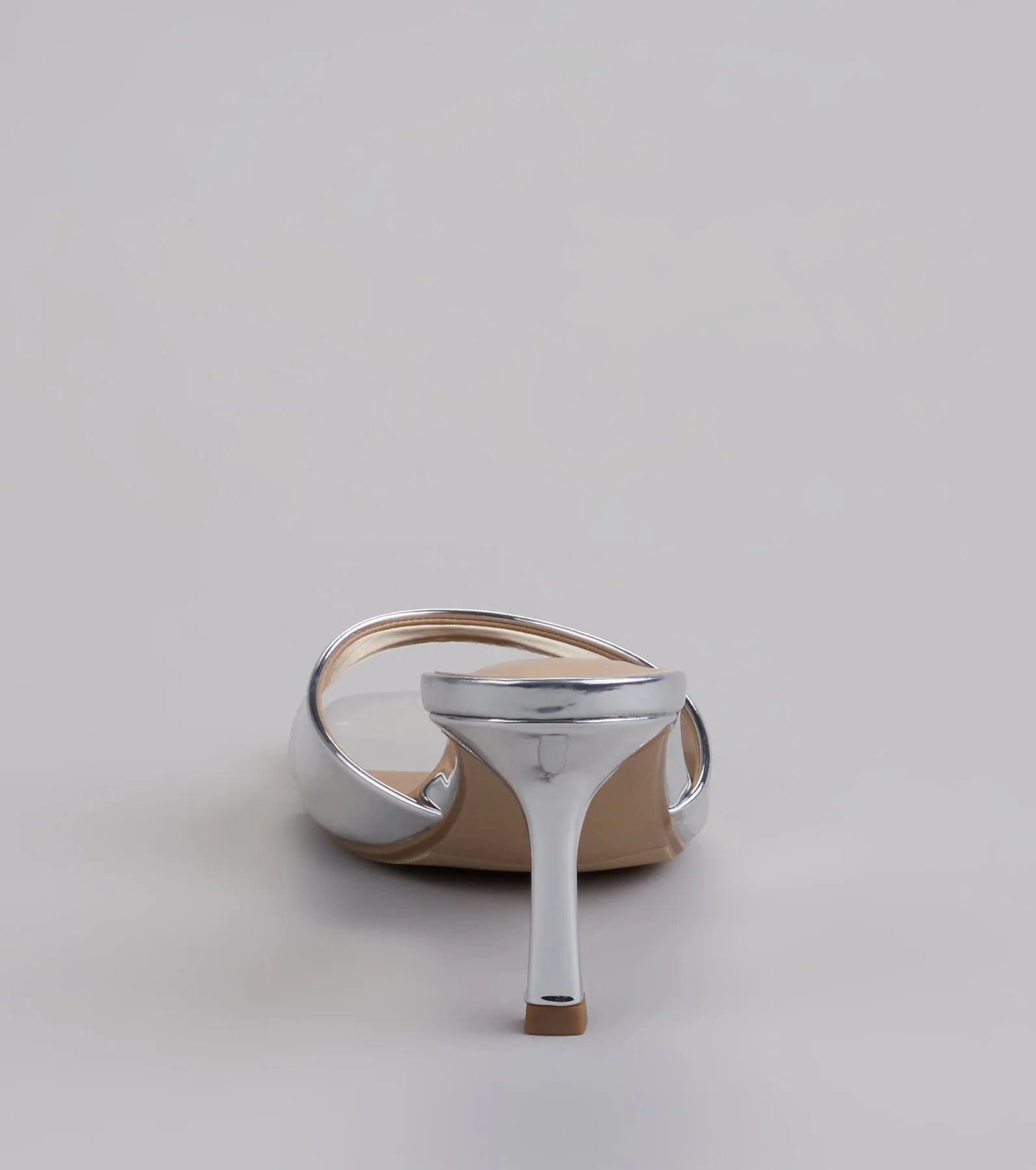 Turn heads in the Glam Stunner Stiletto Mules, silver heels showcasing a fresh trend or stylish detail made to elevate your full Windsor fit.