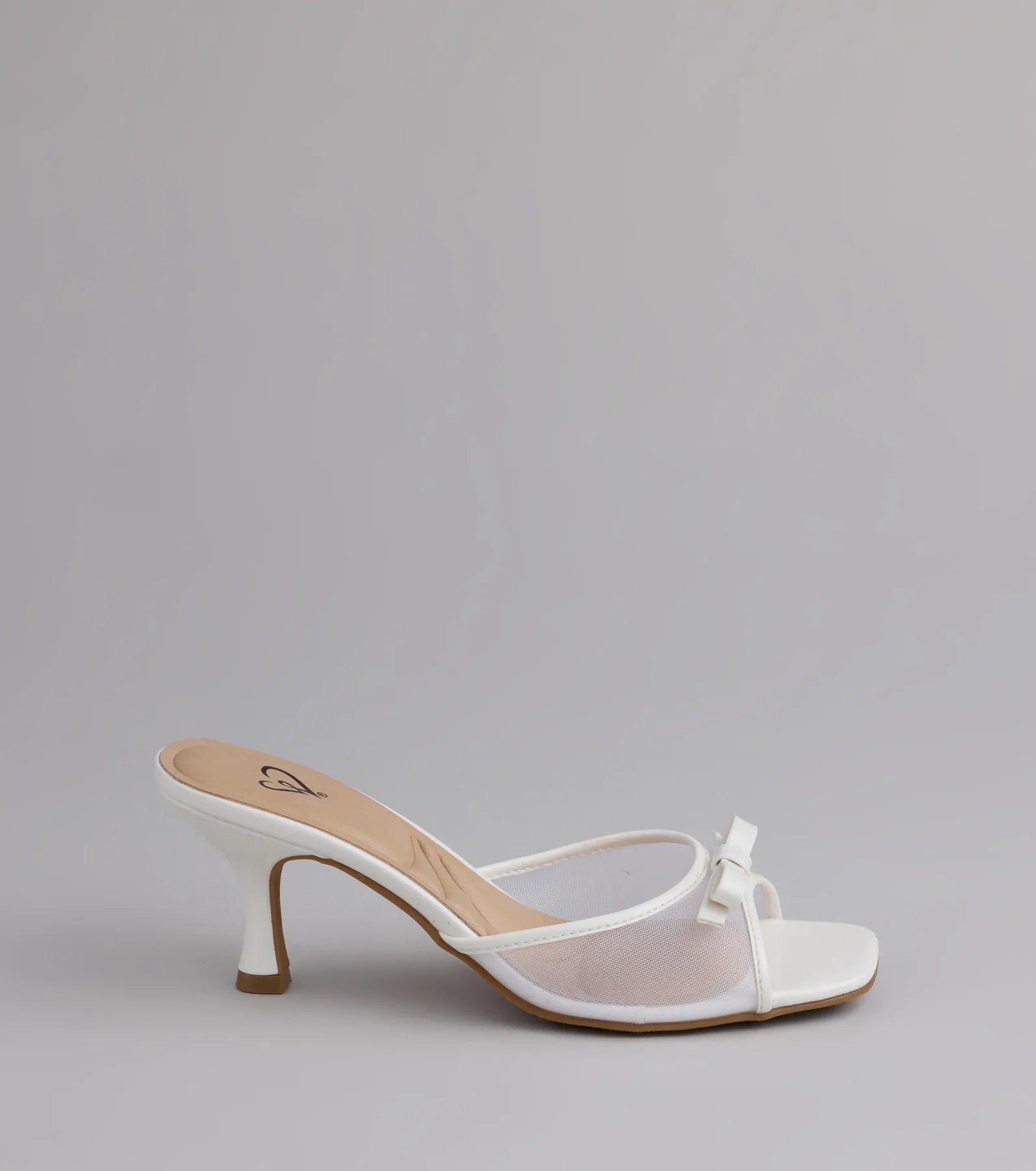 Style made simple with the Soft Glam Mesh Bow Mules in white, trendy women’s shoes that take your outfit from basic to bold in one step.