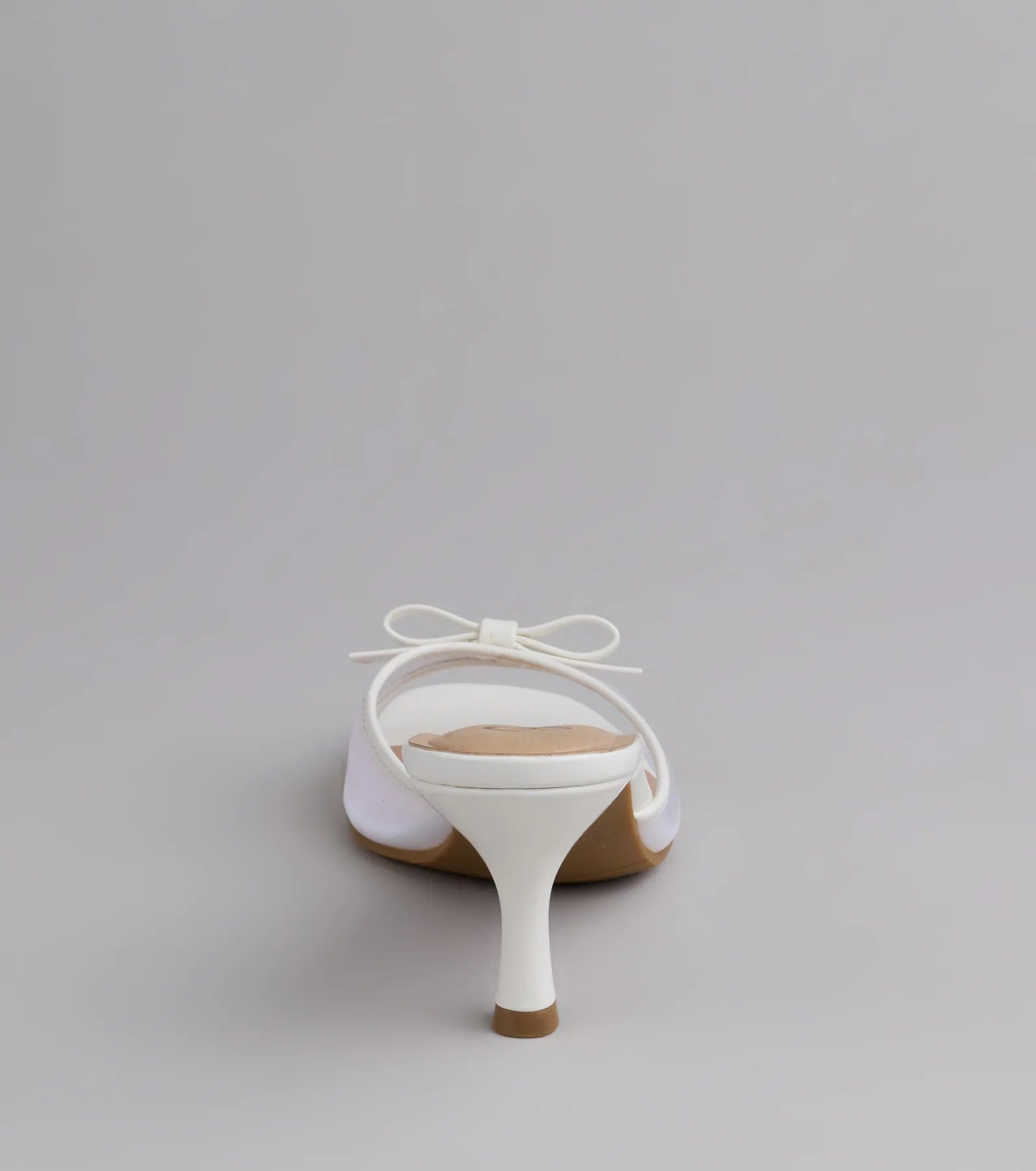 Style made simple with the Soft Glam Mesh Bow Mules in white, trendy women’s shoes that take your outfit from basic to bold in one step.