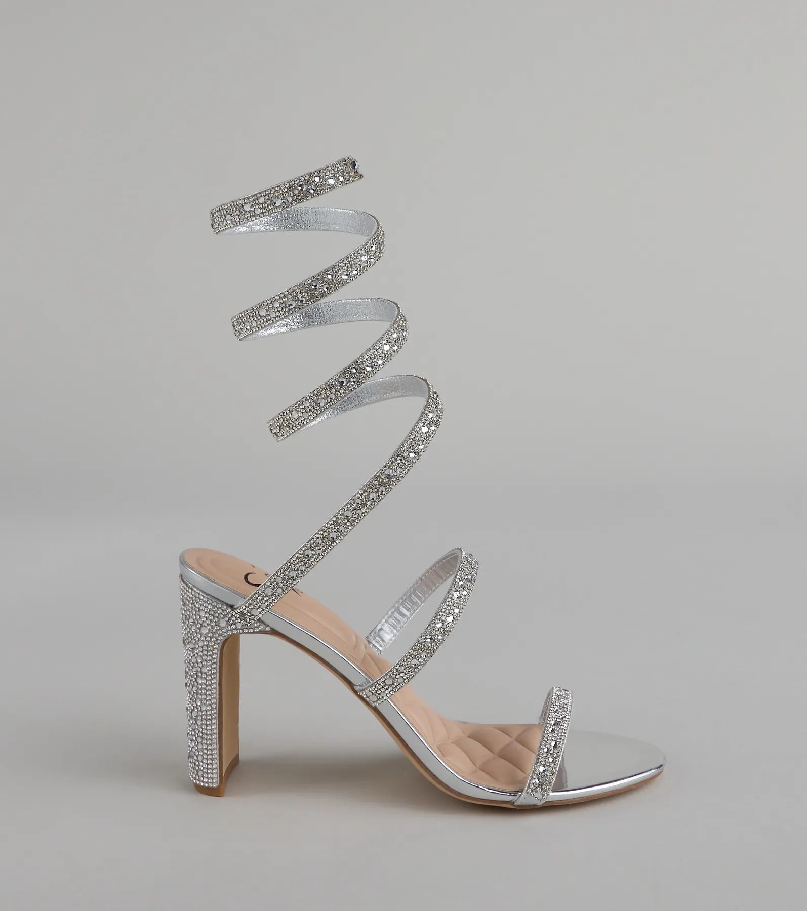 Style made simple with the Feelin' Glam Rhinestone Spiral Strap Block Heels in silver, trendy women’s shoes that take your outfit from basic to bold in one step.