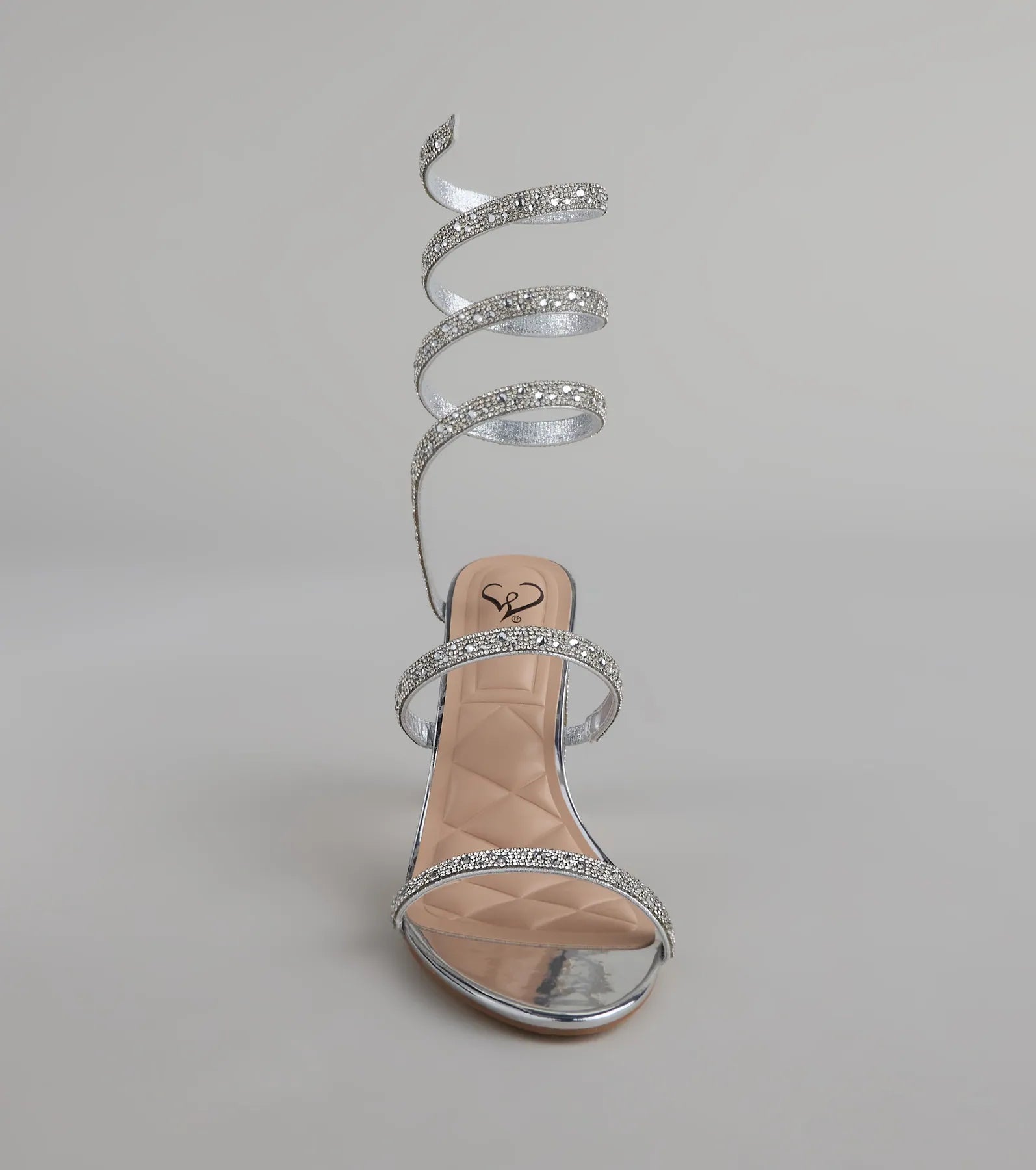 Style made simple with the Feelin' Glam Rhinestone Spiral Strap Block Heels in silver, trendy women’s shoes that take your outfit from basic to bold in one step.