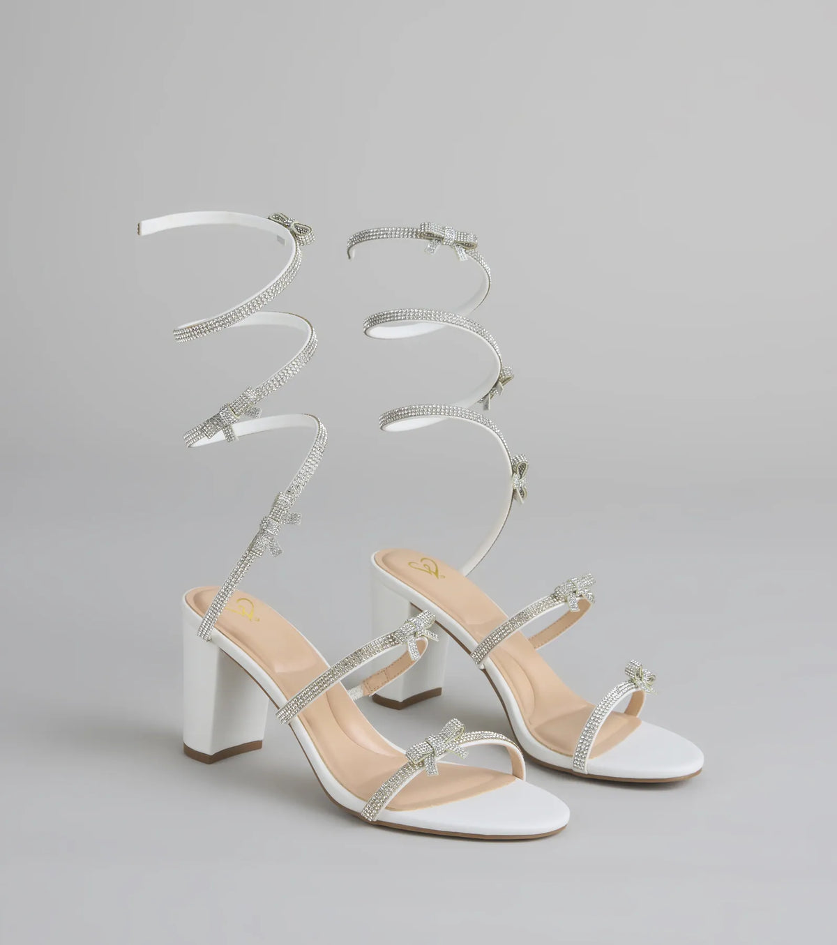 Style made simple with the Put A Bow On It Rhinestone Bow Spiral Heels in white, trendy women’s shoes that take your outfit from basic to bold in one step.