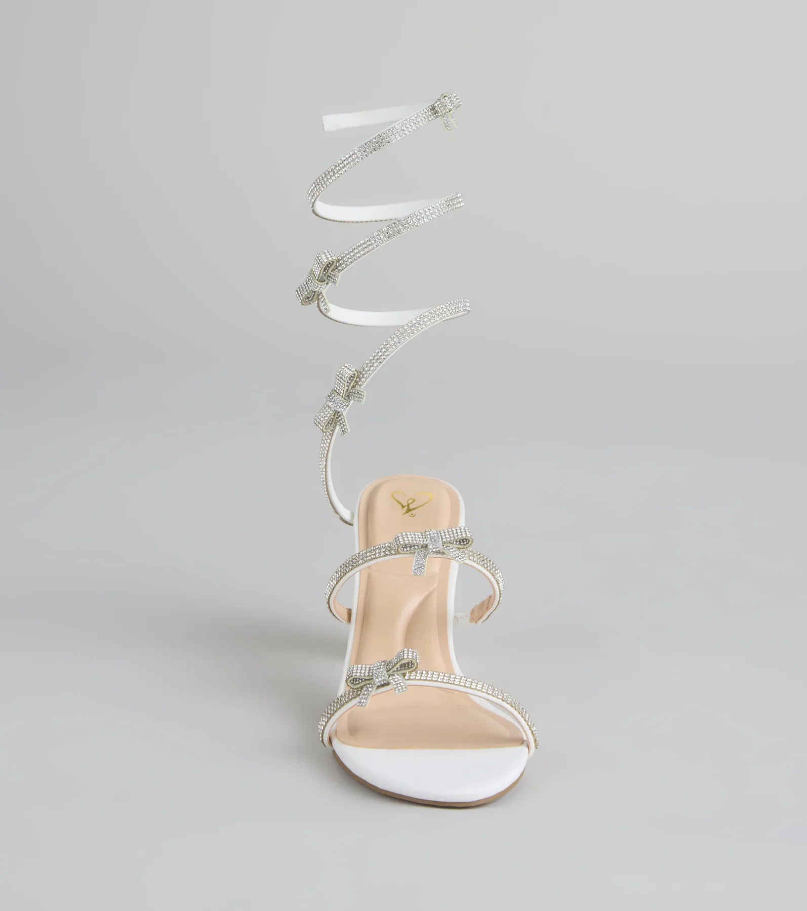 Style made simple with the Put A Bow On It Rhinestone Bow Spiral Heels in white, trendy women’s shoes that take your outfit from basic to bold in one step.