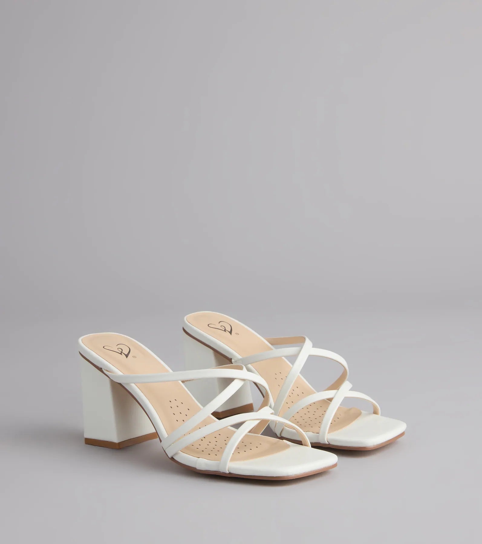 Style made simple with the On Point Criss-Cross Strappy Mules in white, trendy women’s shoes that take your outfit from basic to bold in one step.