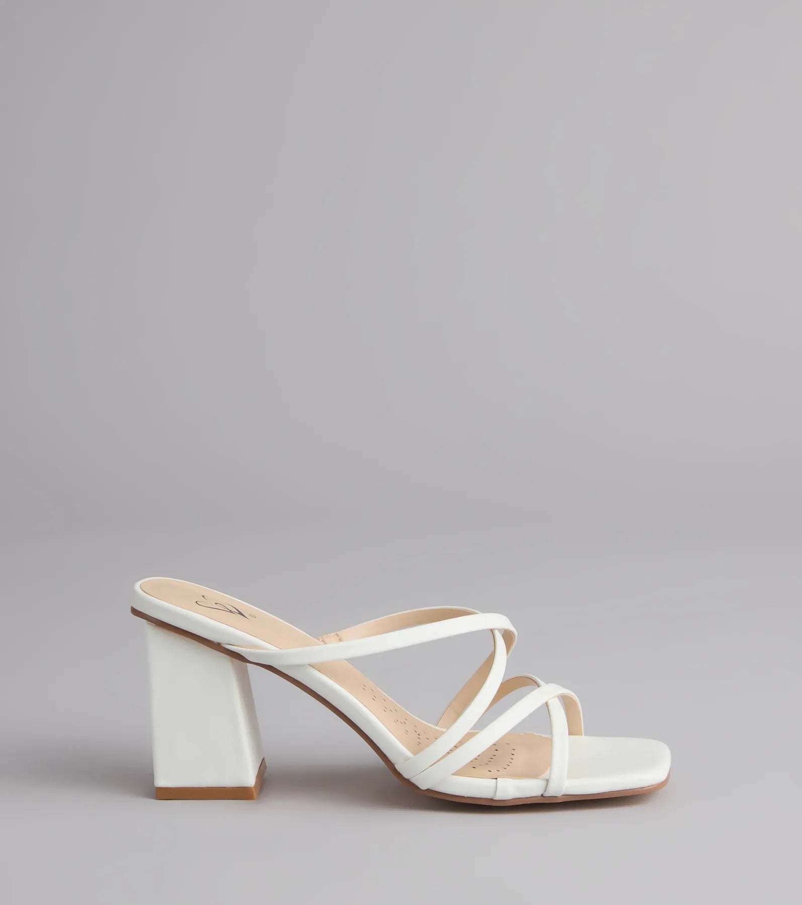 Style made simple with the On Point Criss-Cross Strappy Mules in white, trendy women’s shoes that take your outfit from basic to bold in one step.