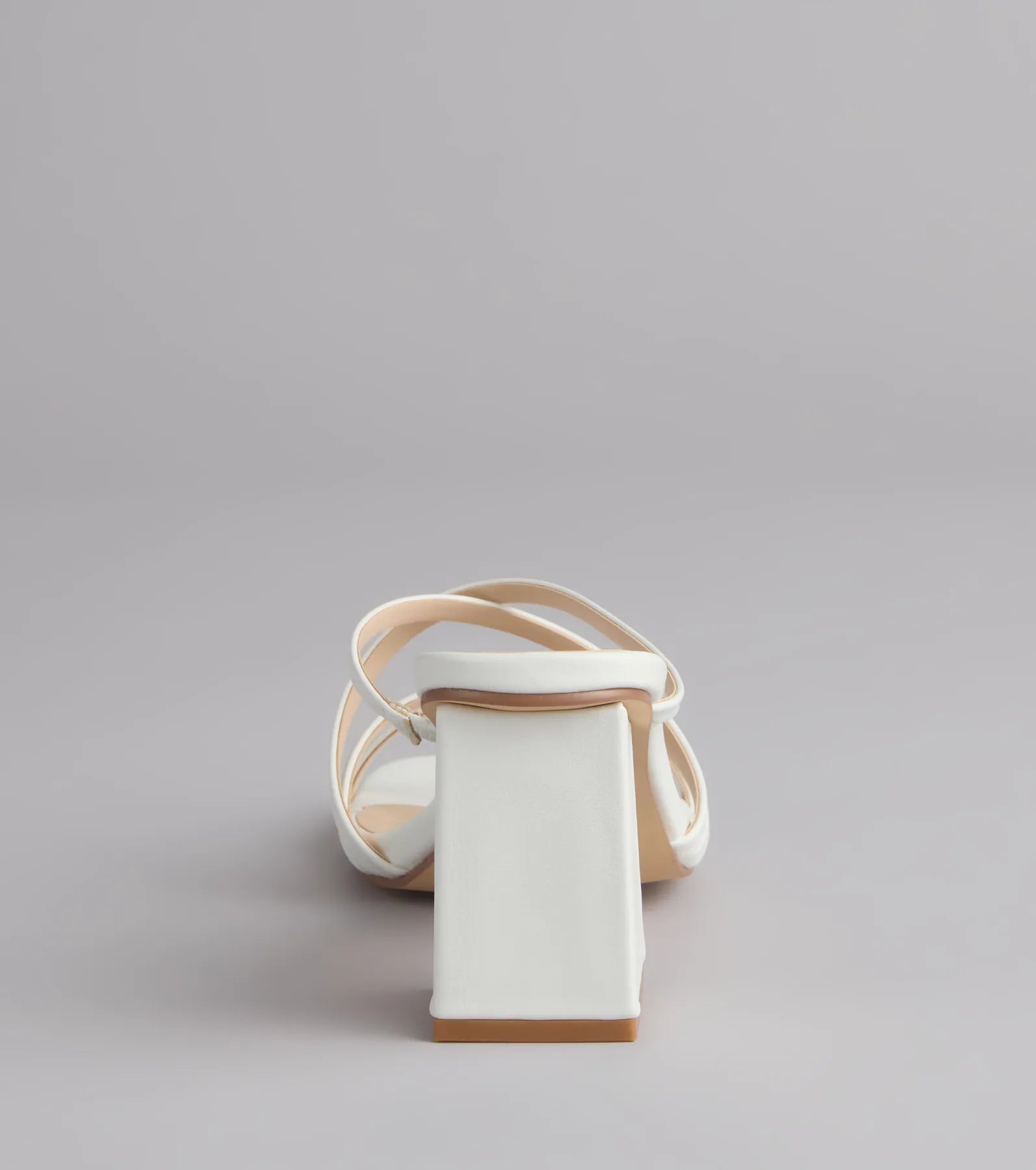 Style made simple with the On Point Criss-Cross Strappy Mules in white, trendy women’s shoes that take your outfit from basic to bold in one step.