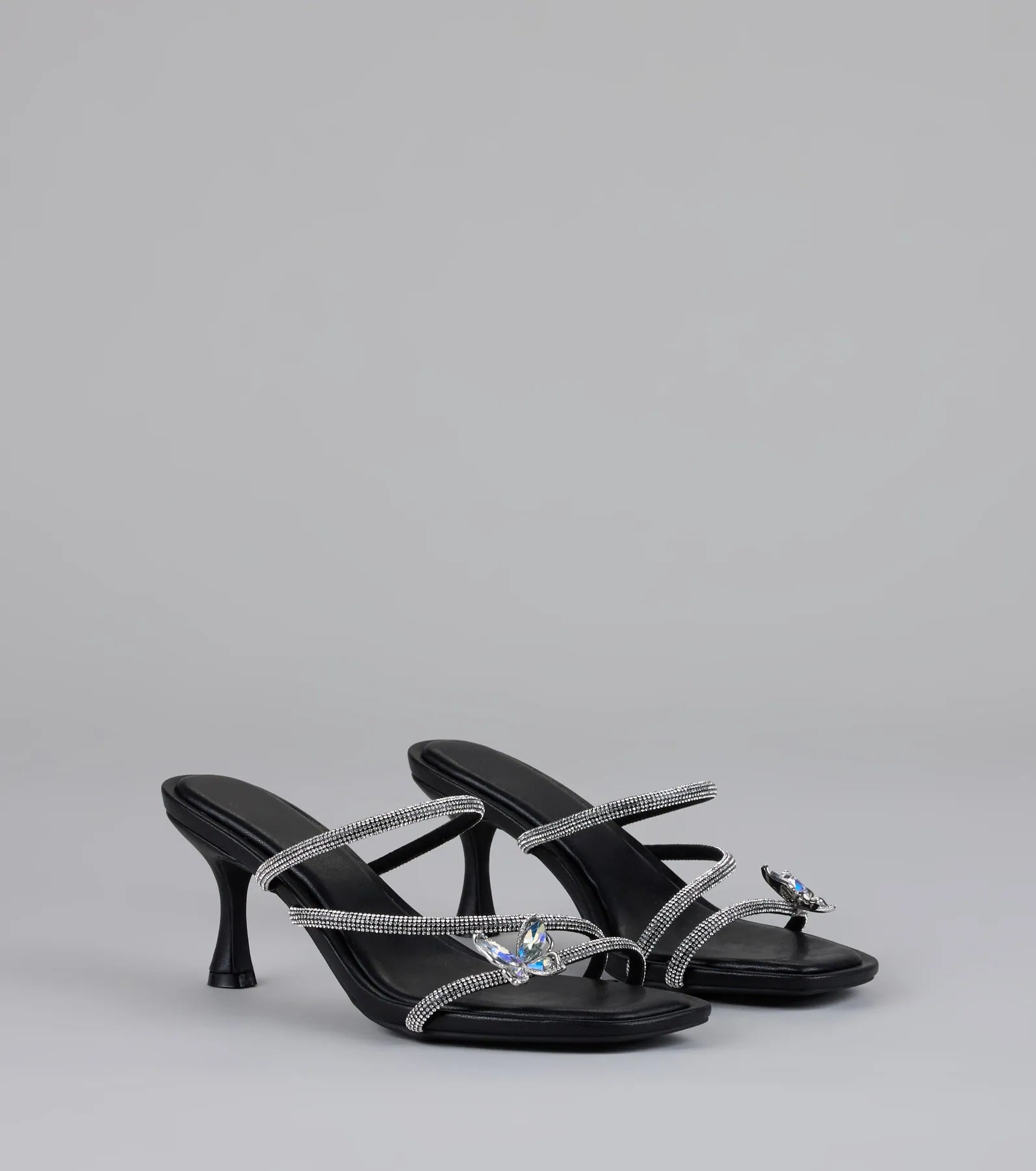 Style made simple with the Winged Whispers Butterfly Rhinestone Mules in black, trendy women’s shoes that take your outfit from basic to bold in one step.