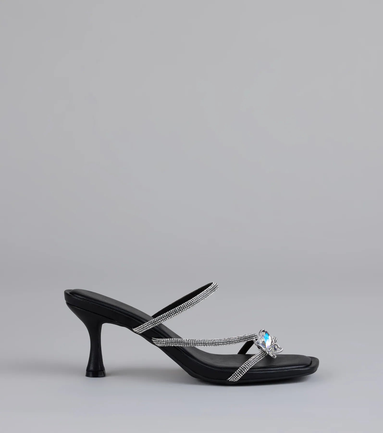 Style made simple with the Winged Whispers Butterfly Rhinestone Mules in black, trendy women’s shoes that take your outfit from basic to bold in one step.