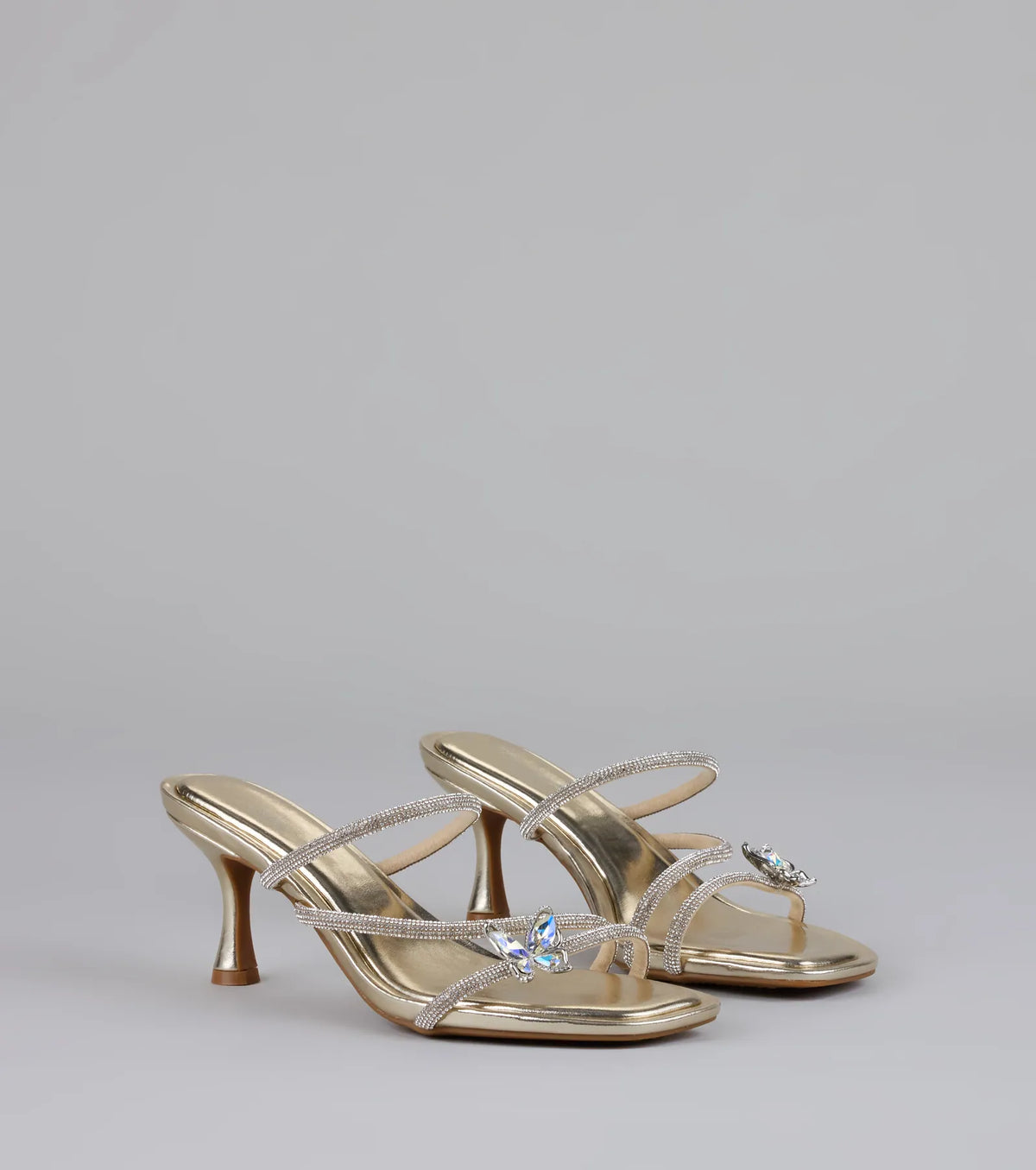 Style made simple with the Butterfly Kisses Rhinestone Metallic Heels in gold, trendy women’s shoes that take your outfit from basic to bold in one step.