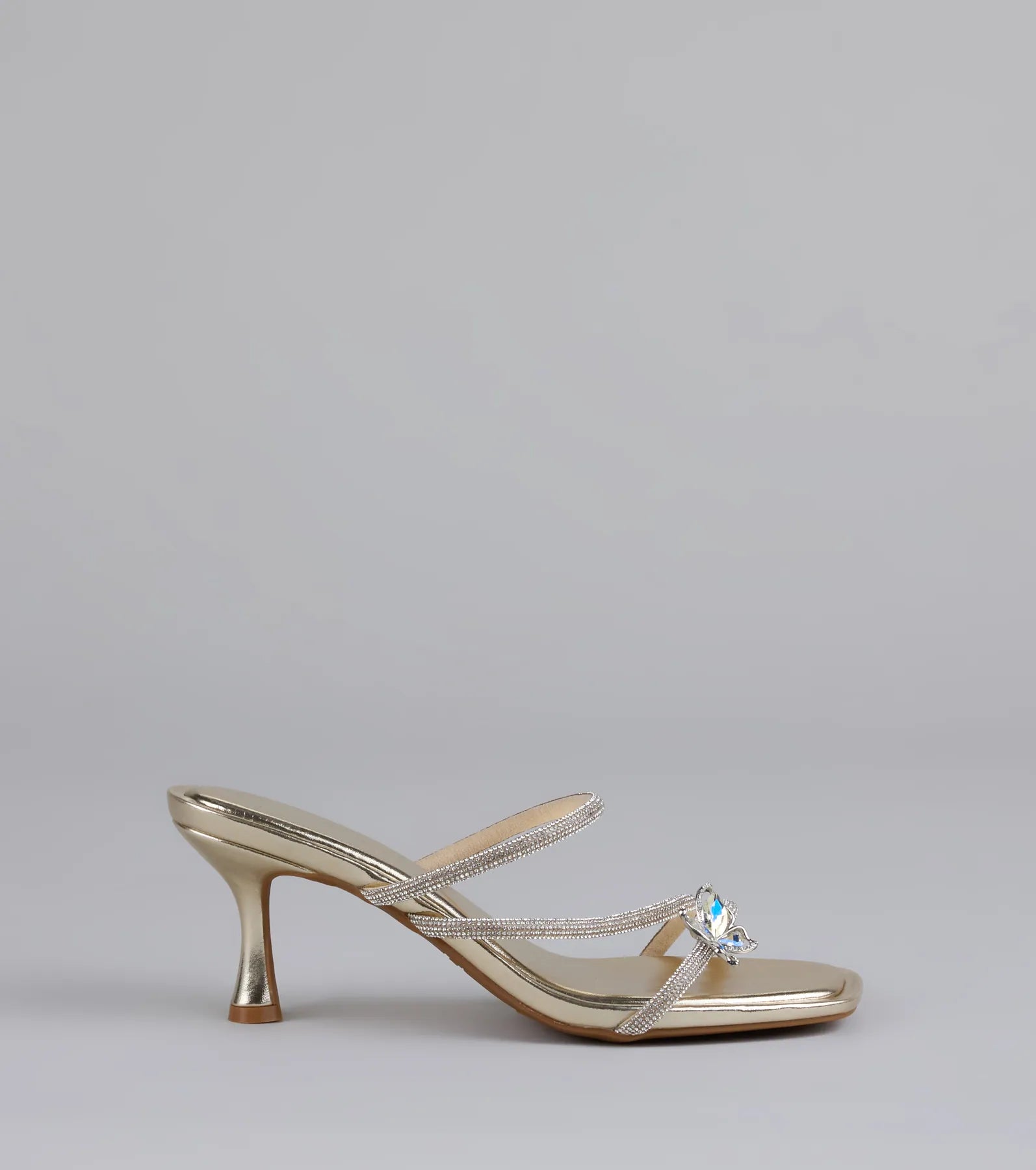Style made simple with the Butterfly Kisses Rhinestone Metallic Heels in gold, trendy women’s shoes that take your outfit from basic to bold in one step.