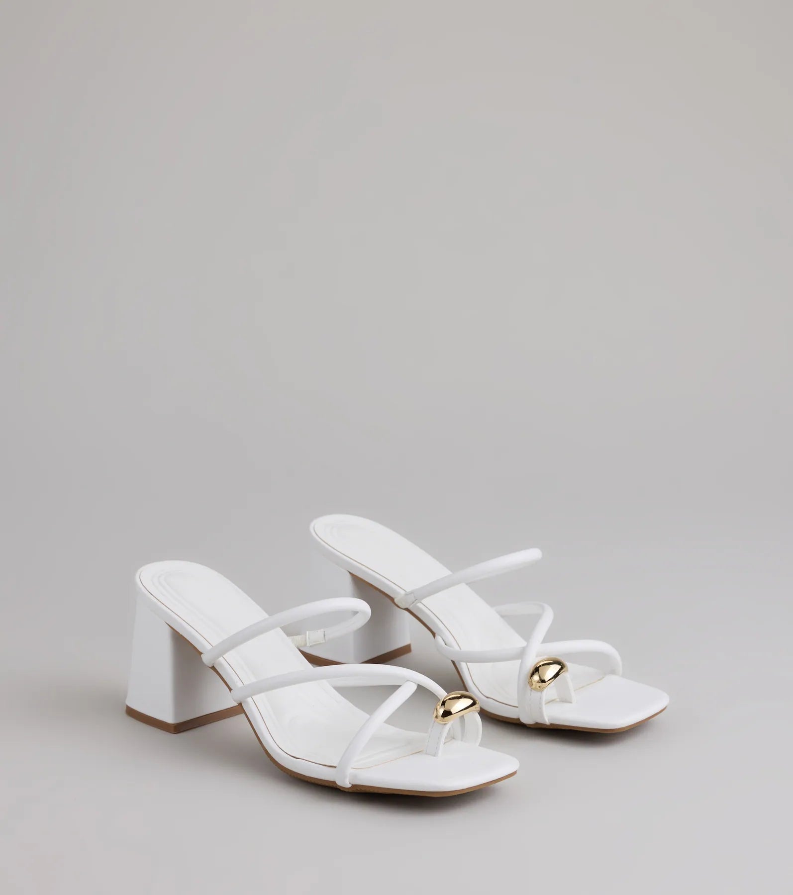 Style made simple with the Walking Pretty Toe Ring Heels in white, trendy women’s shoes that take your outfit from basic to bold in one step.