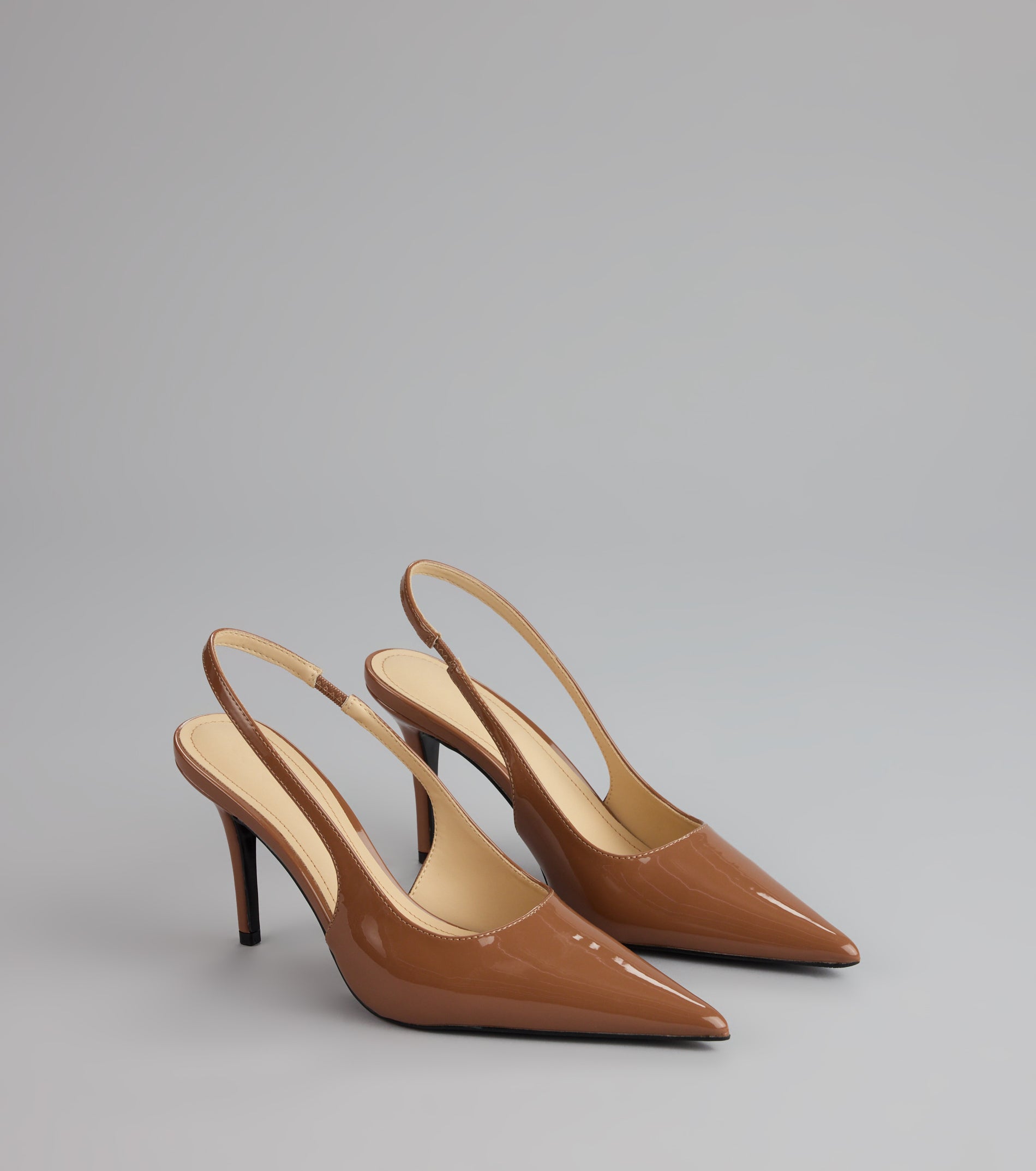 Style made simple with the Sharp Finish Patent Slingback Pumps, trendy women’s shoes that take your outfit from basic to bold in one step.