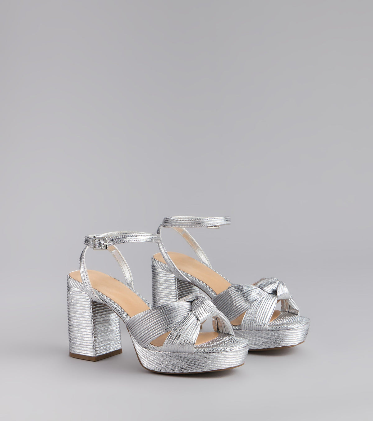 Style made simple with the Shimmer Steps Metallic Block Heels, trendy women’s shoes that take your outfit from basic to bold in one step.