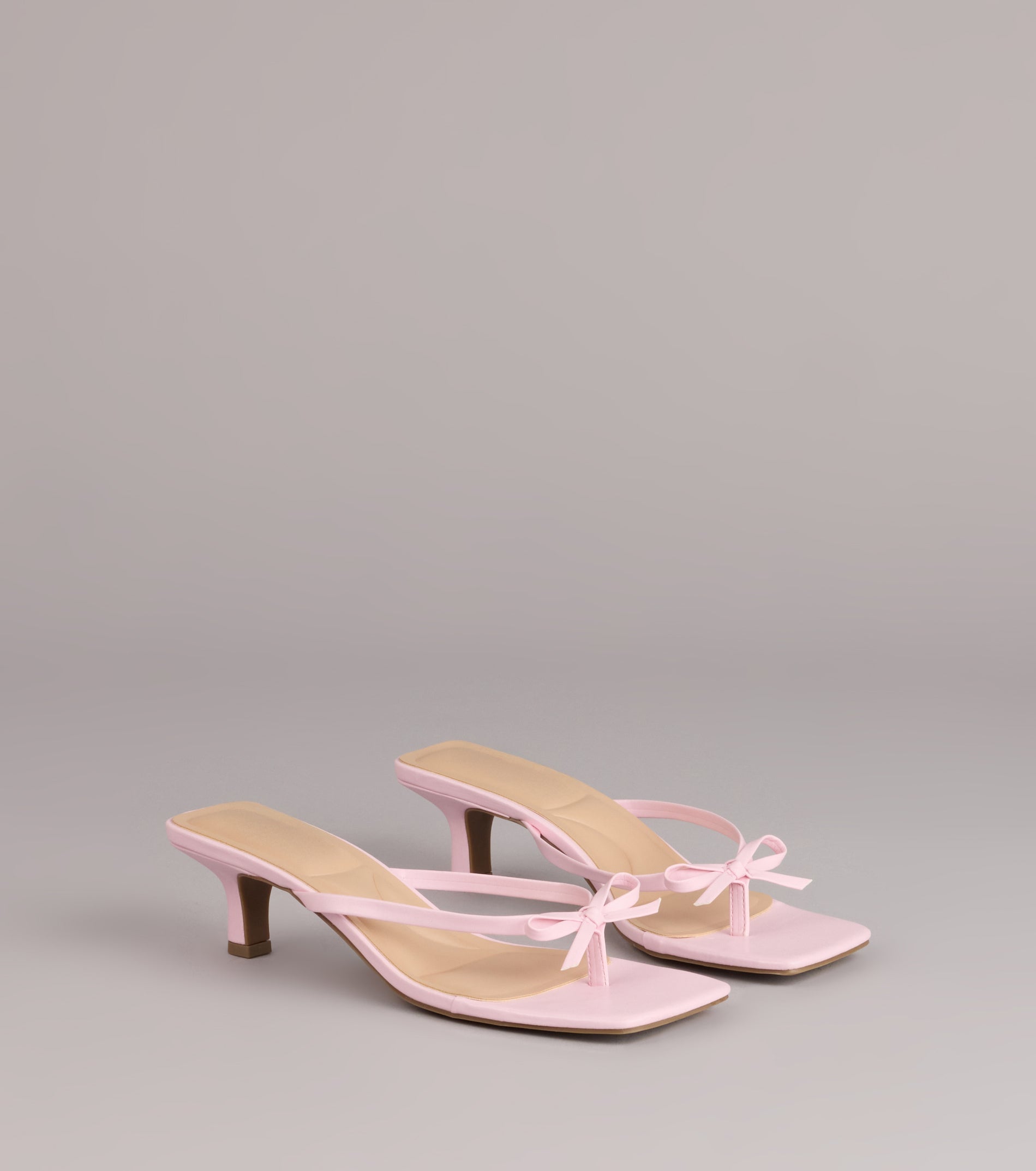 Style made simple with the Play Nice Bow Thong Heels, trendy women’s shoes that take your outfit from basic to bold in one step.