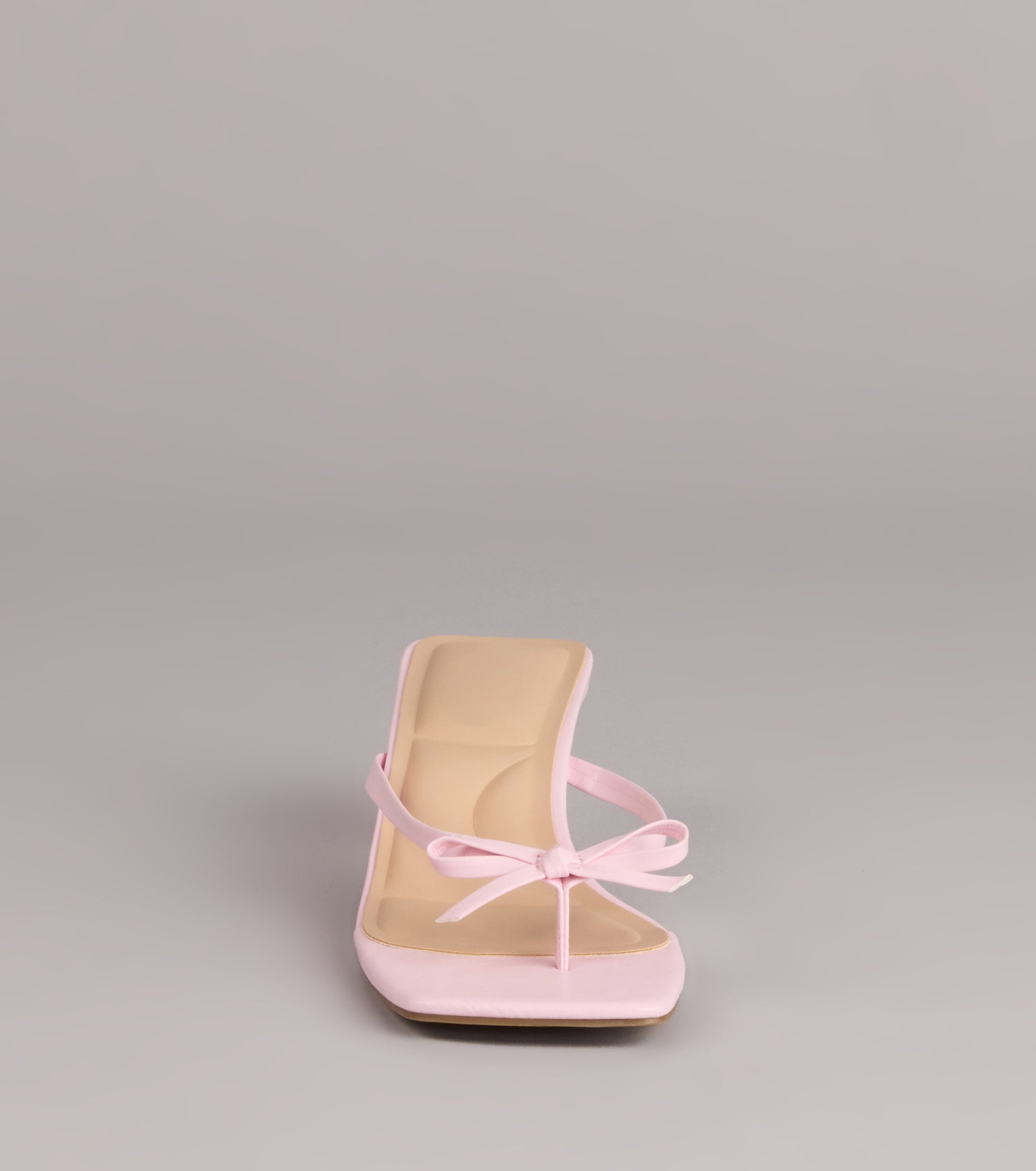 Style made simple with the Play Nice Bow Thong Heels, trendy women’s shoes that take your outfit from basic to bold in one step.