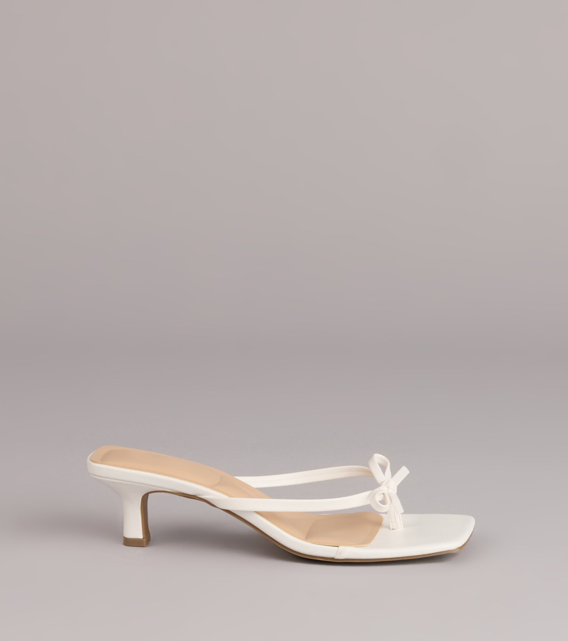 Style made simple with the Play Nice Bow Thong Heels, trendy women’s shoes that take your outfit from basic to bold in one step.