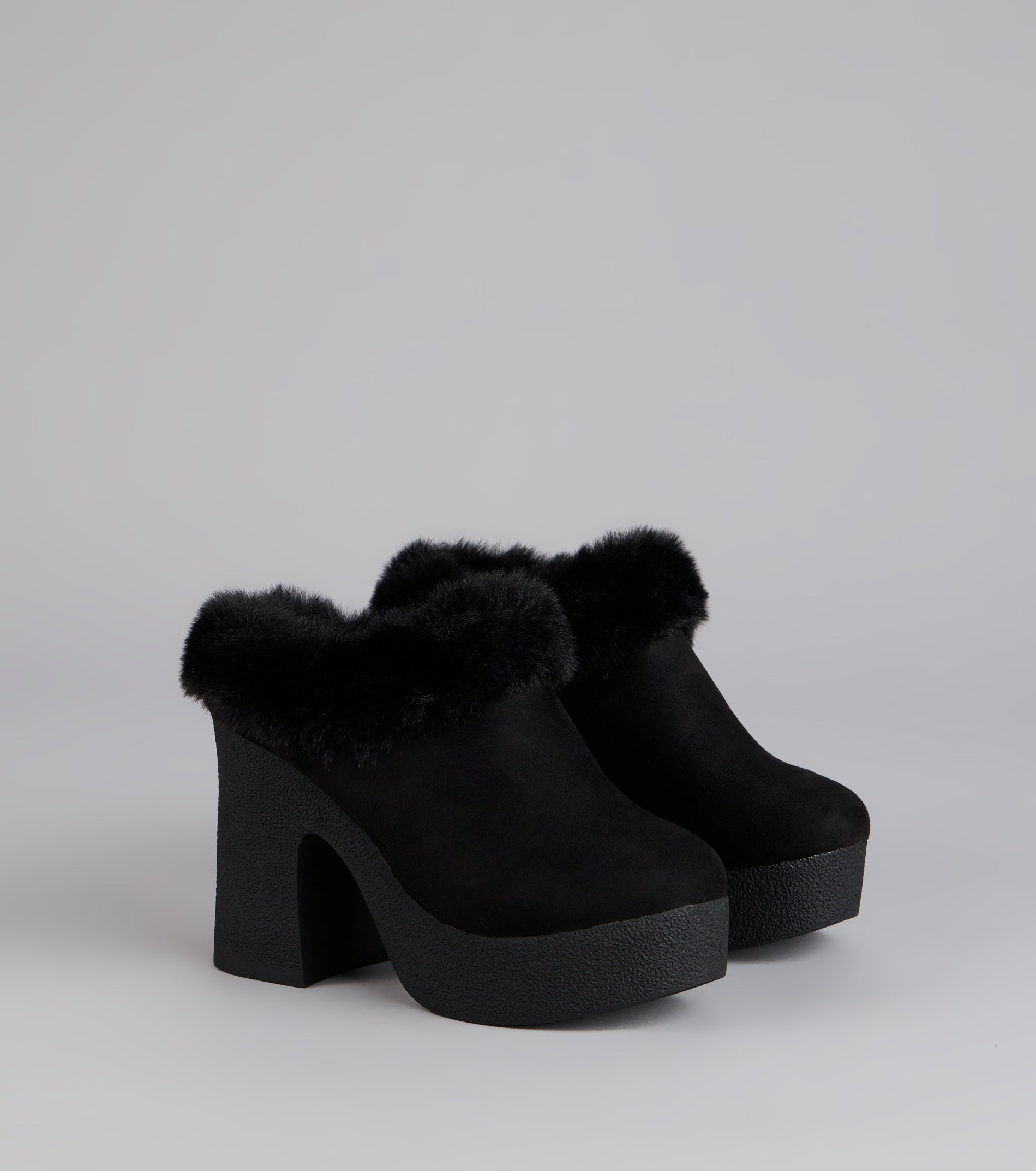 Style made simple with the Fuzzy Feel Chunky Clog Mules in black, trendy women’s shoes that take your outfit from basic to bold in one step.
