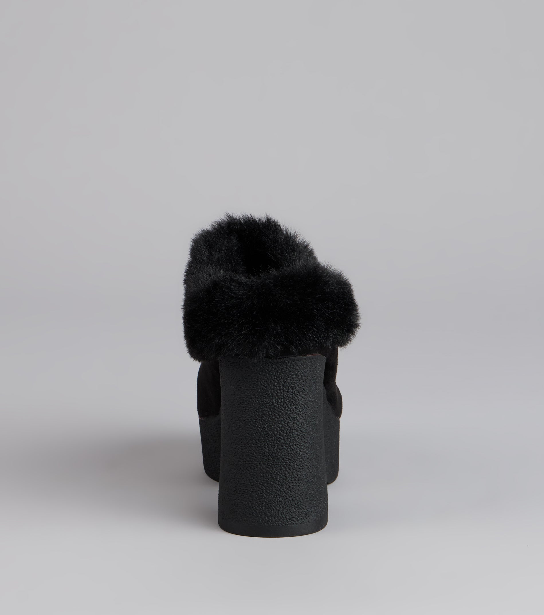 This black piece brings trend-right energy to the Fuzzy Feel Chunky Clog Mules, perfect for fall outfits that stand out.