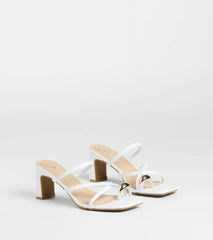 Style made simple with the Sweet Attraction Toe Ring Strappy Block Heels in white, trendy women’s shoes that take your outfit from basic to bold in one step.