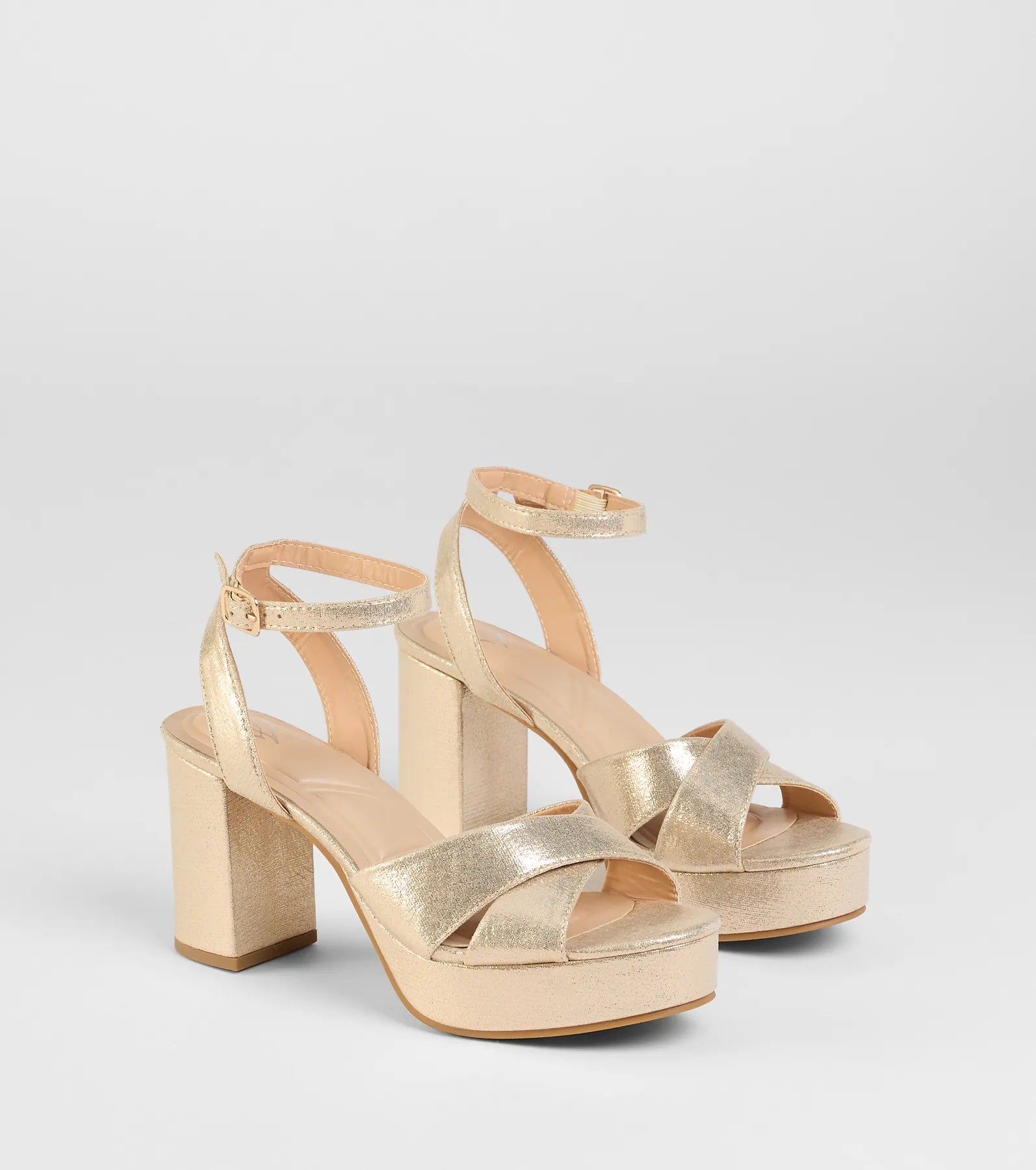 Style made simple with the Special Surprise Criss Cross Platform Block Heels in gold, trendy women’s shoes that take your outfit from basic to bold in one step.