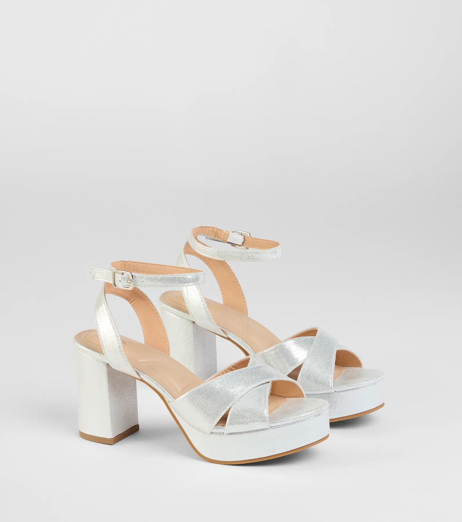 Style made simple with the Special Surprise Criss Cross Platform Block Heels in silver, trendy women’s shoes that take your outfit from basic to bold in one step.