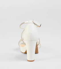 Elevate warm-weather looks with Night Shimmer Rhinestone Platform Block Heels in white, a pair of trendy sandals bringing chic, modern flair to every step.