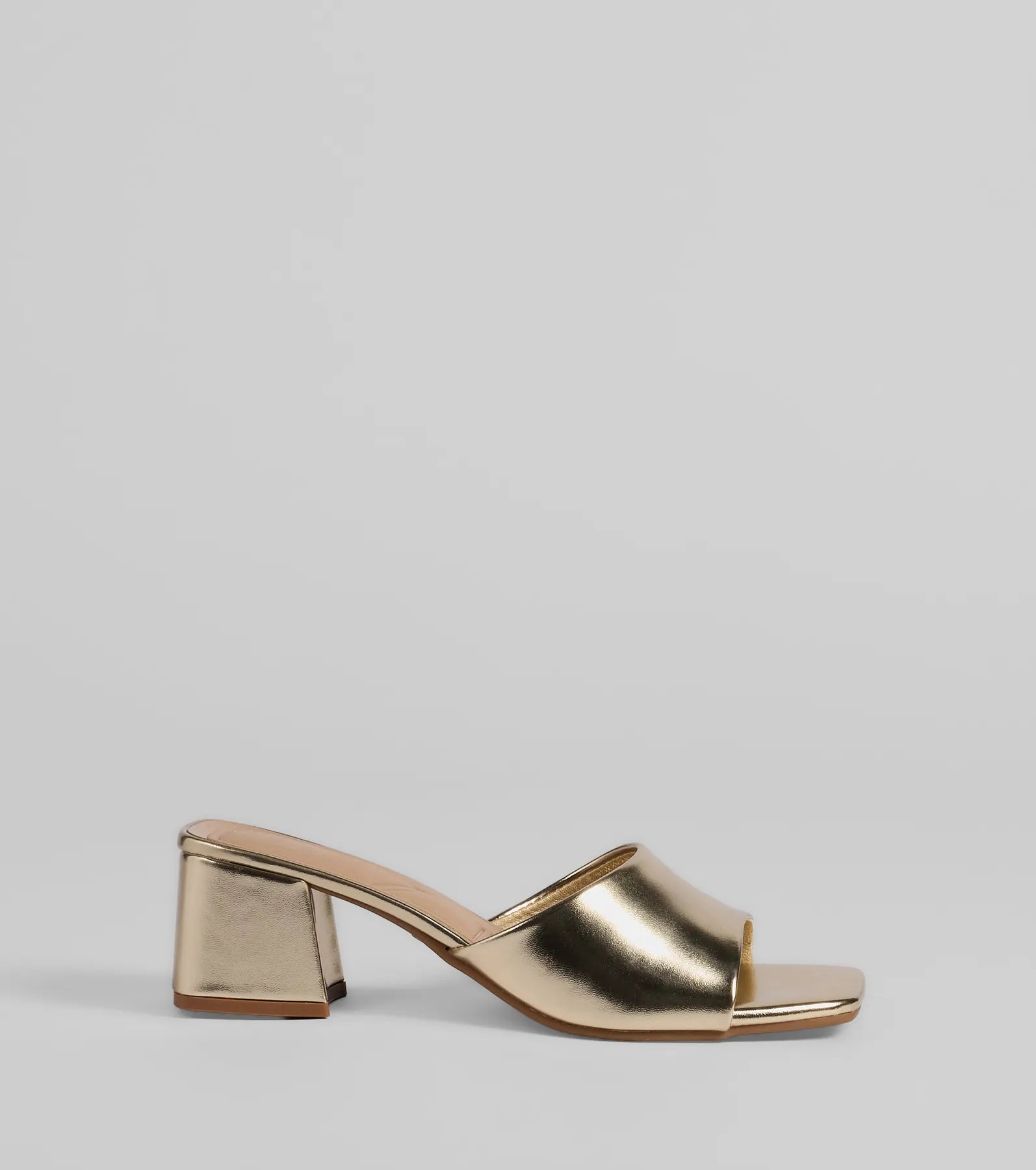 Elevate warm-weather looks with Chic Upgrade Basic Block Heel Mules in gold, a pair of trendy sandals bringing chic, modern flair to every step.