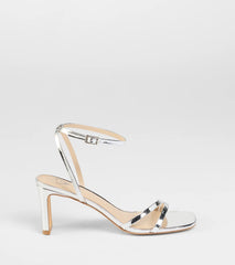 Elevate warm-weather looks with So Obsessed Metallic Strappy Block Heels in silver, a pair of trendy sandals bringing chic, modern flair to every step.