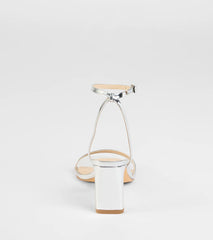 Elevate warm-weather looks with So Obsessed Metallic Strappy Block Heels in silver, a pair of trendy sandals bringing chic, modern flair to every step.