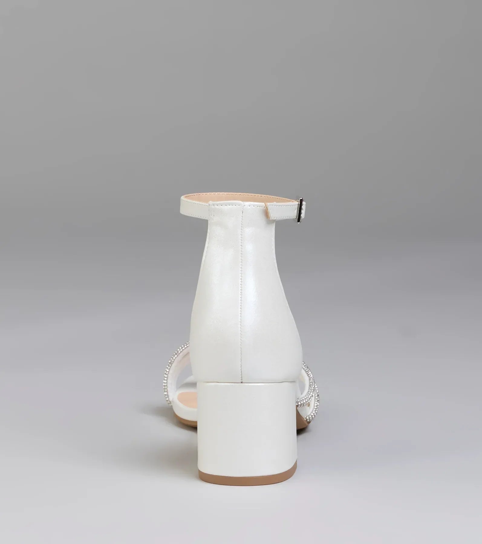 Elevate warm-weather looks with Ultra Luxe Rhinestone Short Block Heels in pearl, a pair of trendy sandals bringing chic, modern flair to every step.