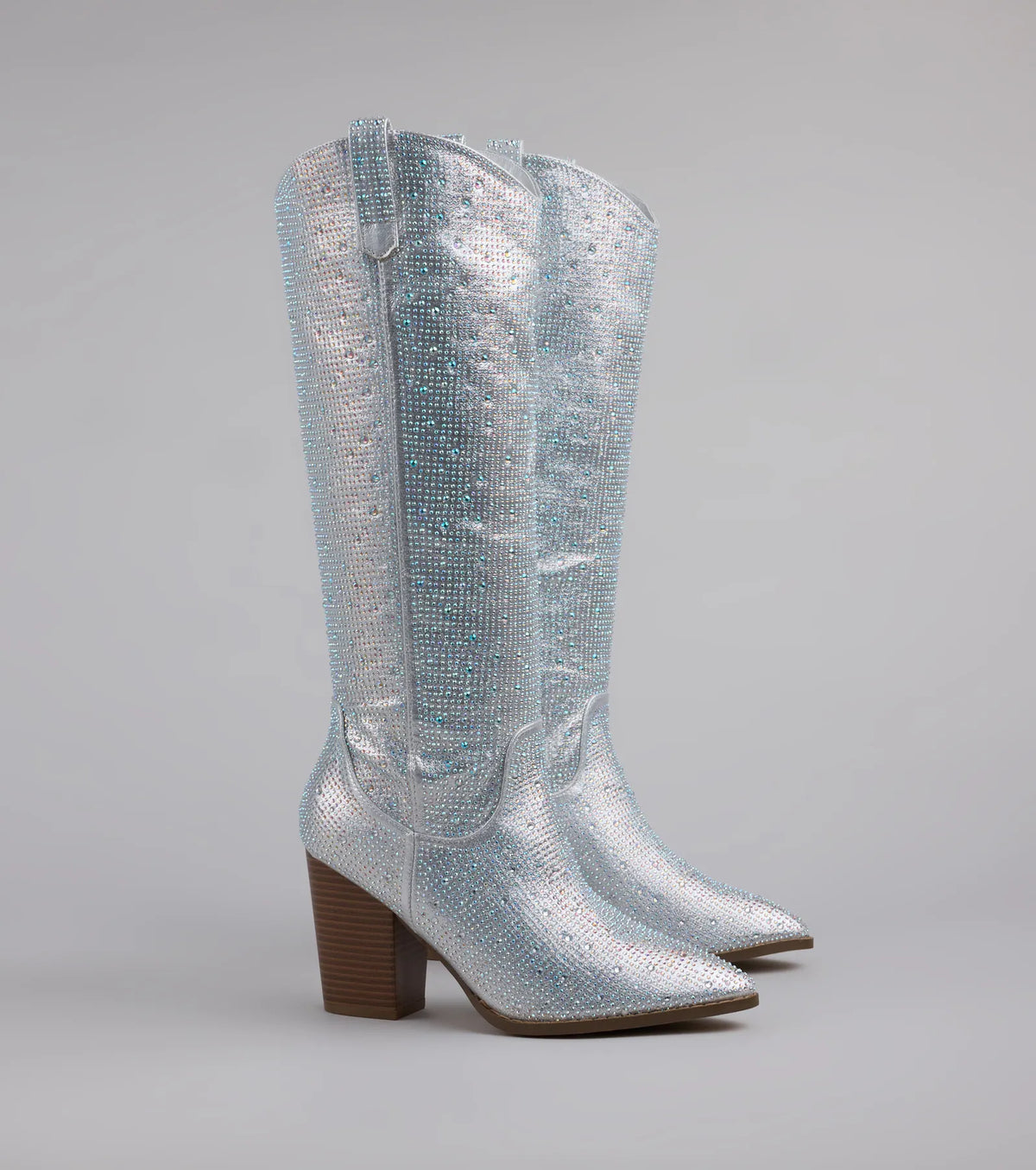 Style made simple with the Shimmer And Shine Rhinestone Cowboy Boots in silver, trendy women’s shoes that take your outfit from basic to bold in one step.
