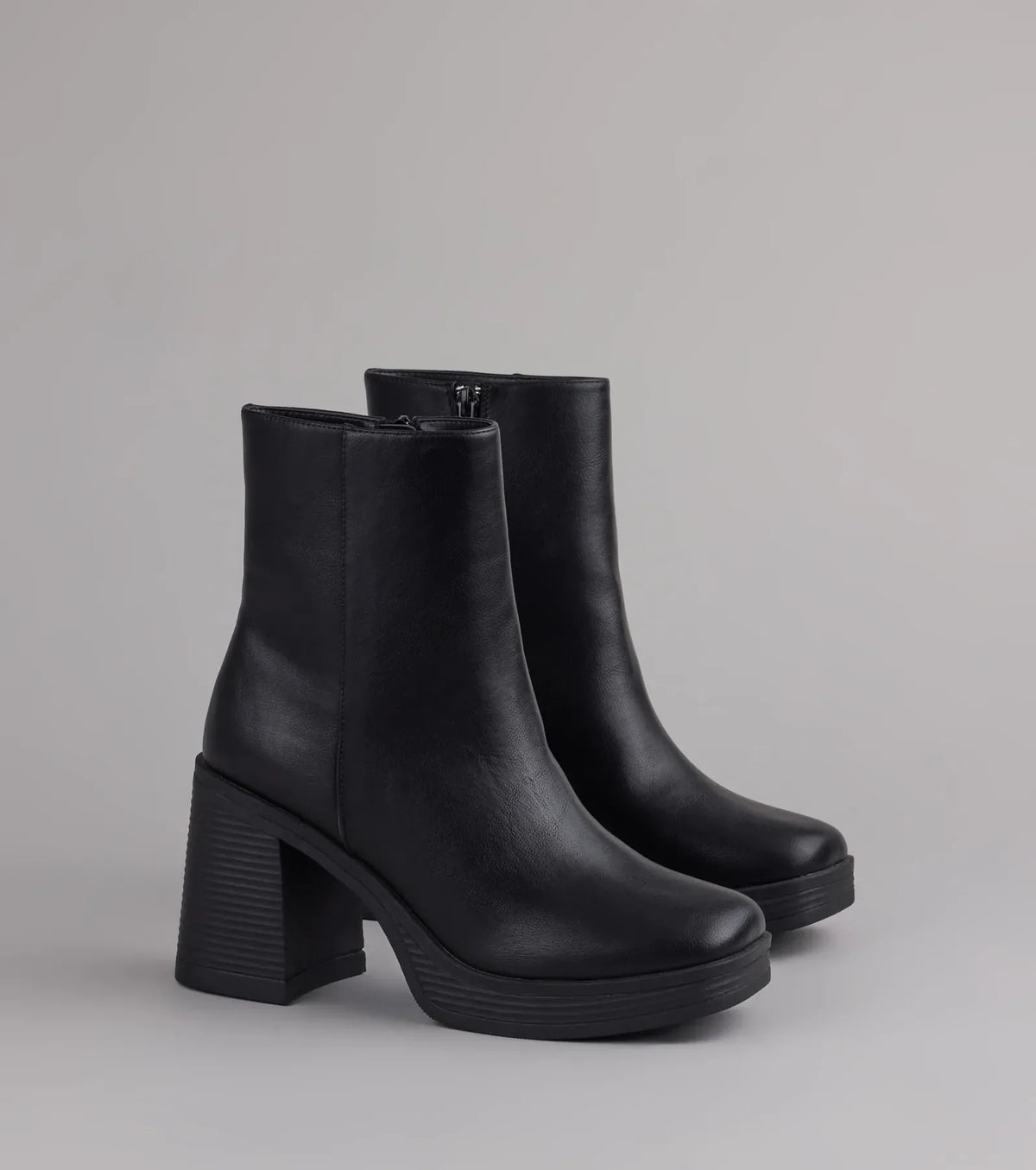 Style made simple with the Tough Love Platform Block Heel Booties in black, trendy women’s shoes that take your outfit from basic to bold in one step.