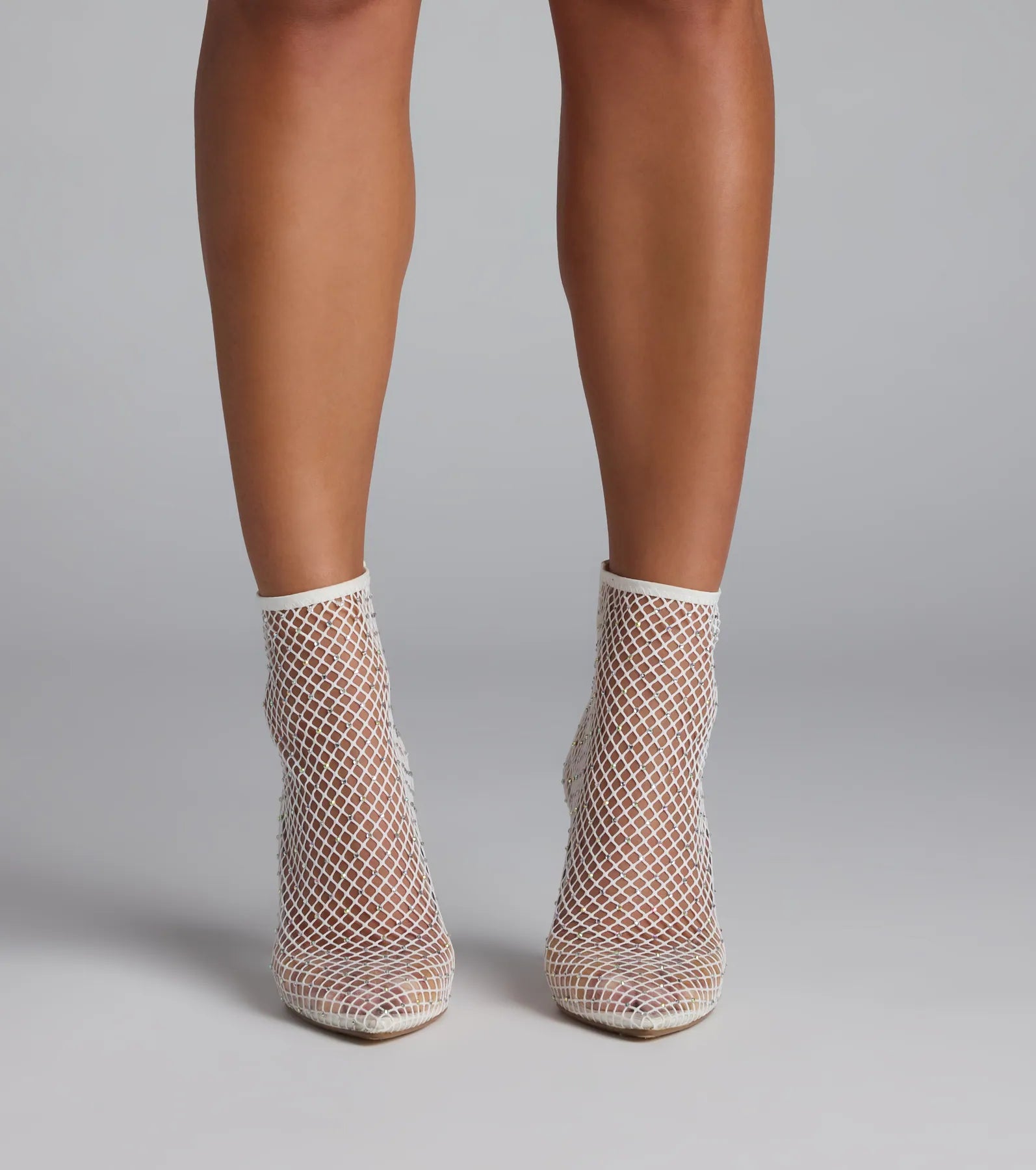 Style made simple with the Up To No Good Rhinestone Fishnet Booties in white, trendy women’s shoes that take your outfit from basic to bold in one step.