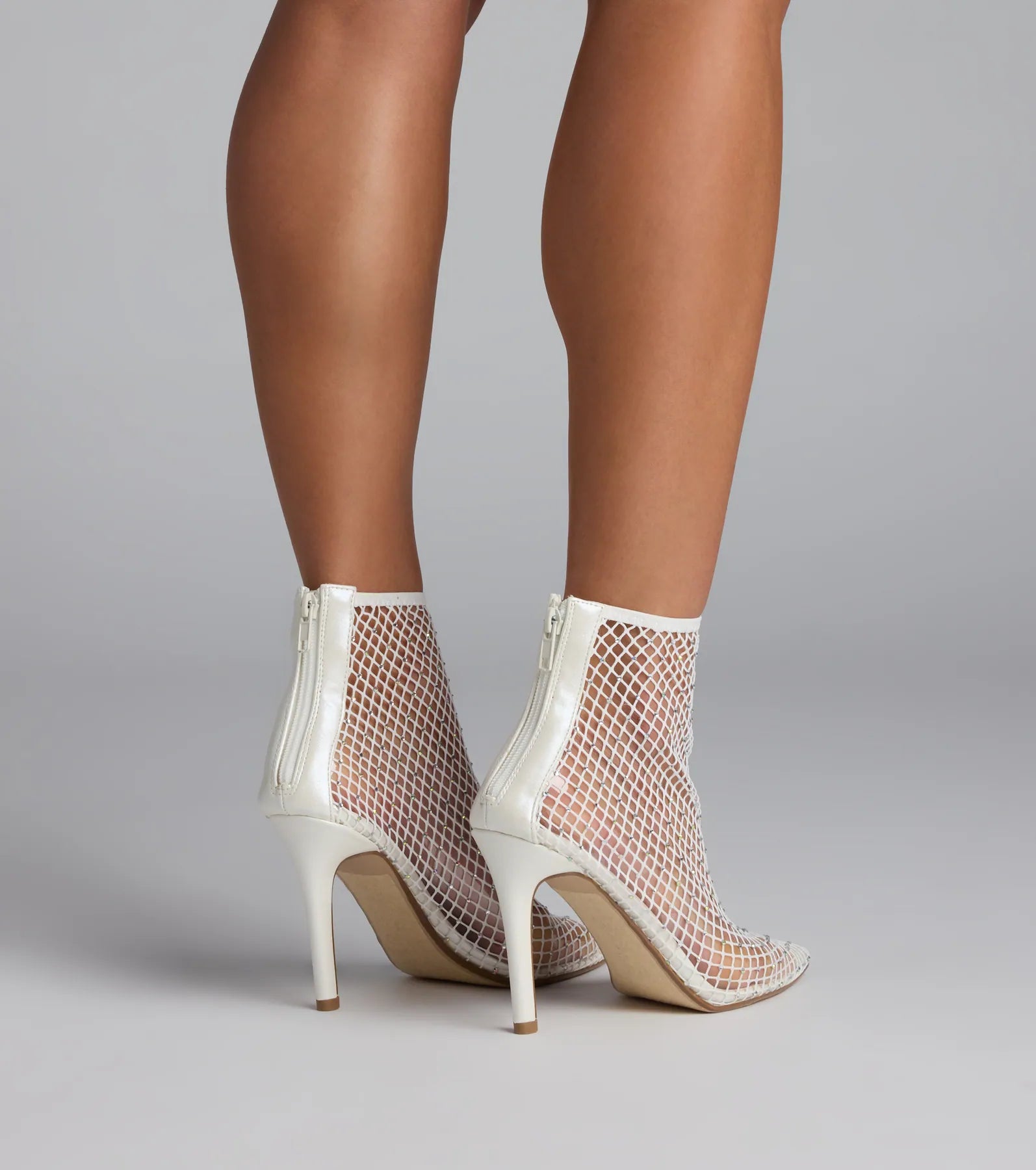Style made simple with the Up To No Good Rhinestone Fishnet Booties in white, trendy women’s shoes that take your outfit from basic to bold in one step.