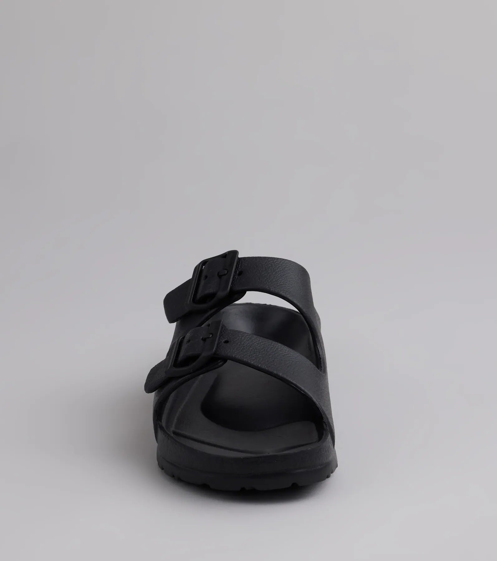 Style made simple with the Tag Along Strappy Buckle Sandals in black, trendy women’s shoes that take your outfit from basic to bold in one step.