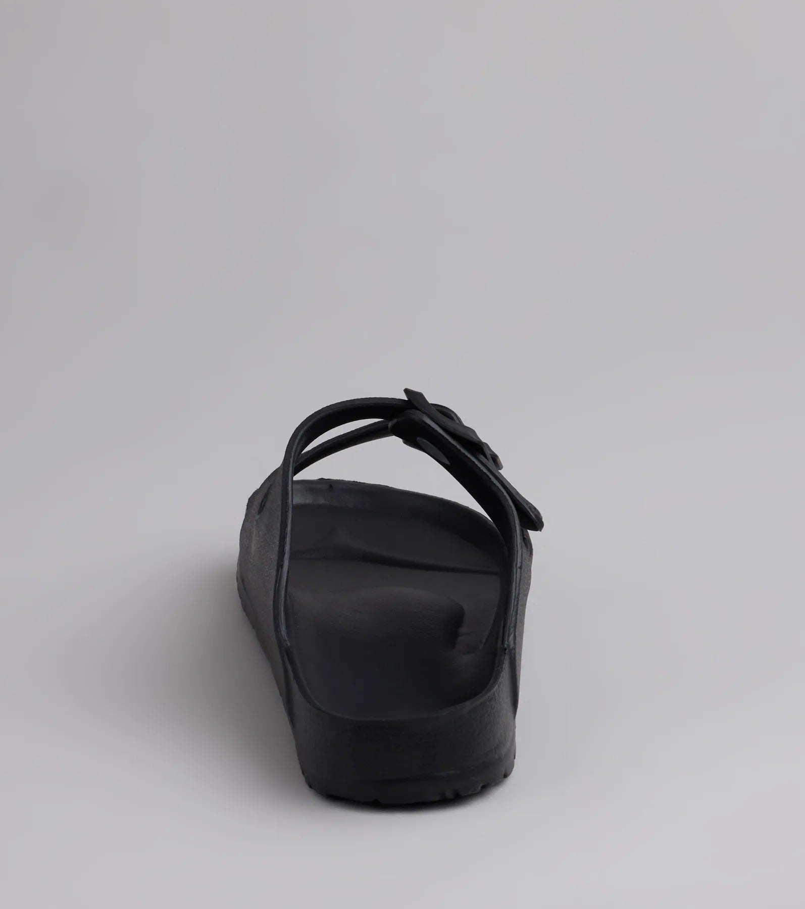 Style made simple with the Tag Along Strappy Buckle Sandals in black, trendy women’s shoes that take your outfit from basic to bold in one step.