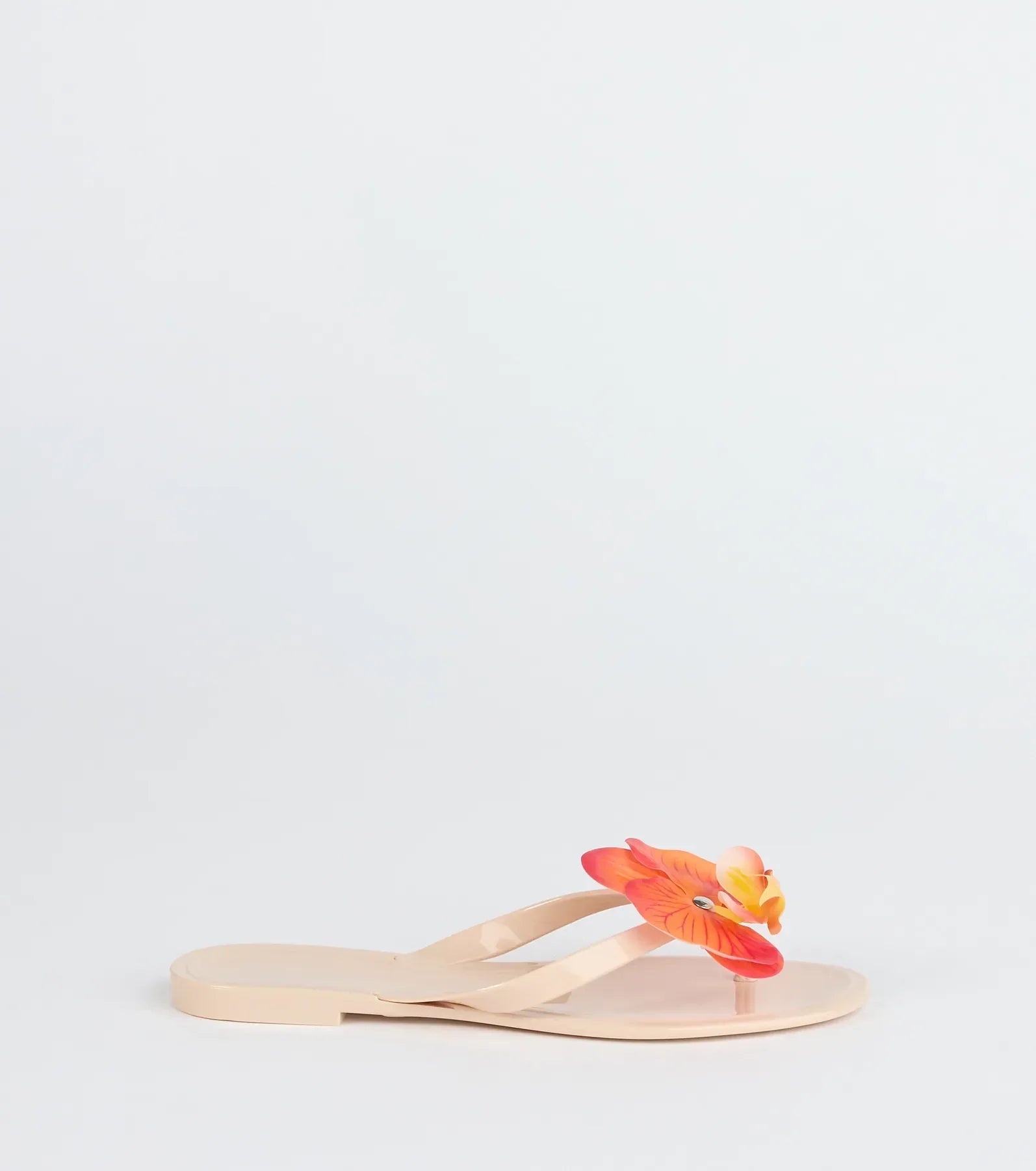 Elevate warm-weather looks with On Vacay Flower Strap Jelly Sandals in nude, a pair of trendy sandals bringing chic, modern flair to every step.