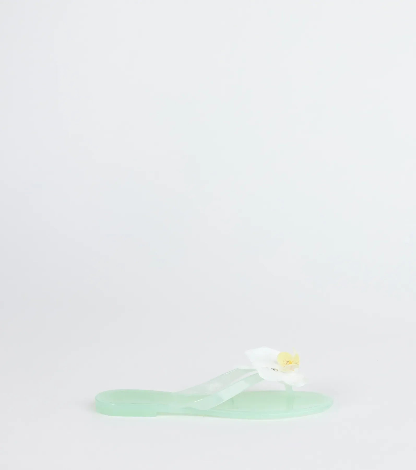 Elevate warm-weather looks with On Vacay Flower Strap Jelly Sandals in mint green, a pair of trendy sandals bringing chic, modern flair to every step.