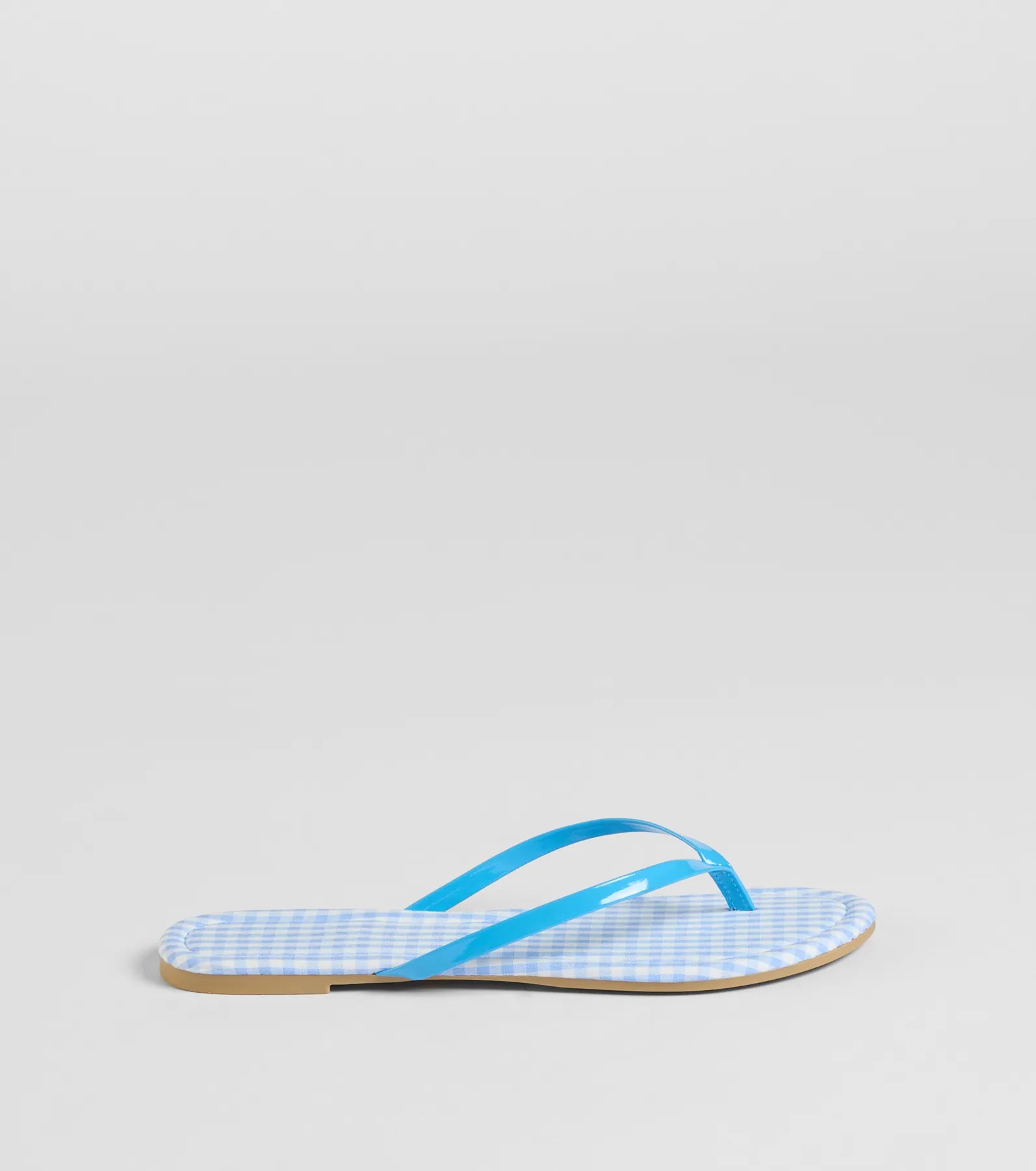 Elevate warm-weather looks with Cutie Vibe Gingham Print Thong Strap Sandals in blue, a pair of trendy sandals bringing chic, modern flair to every step.