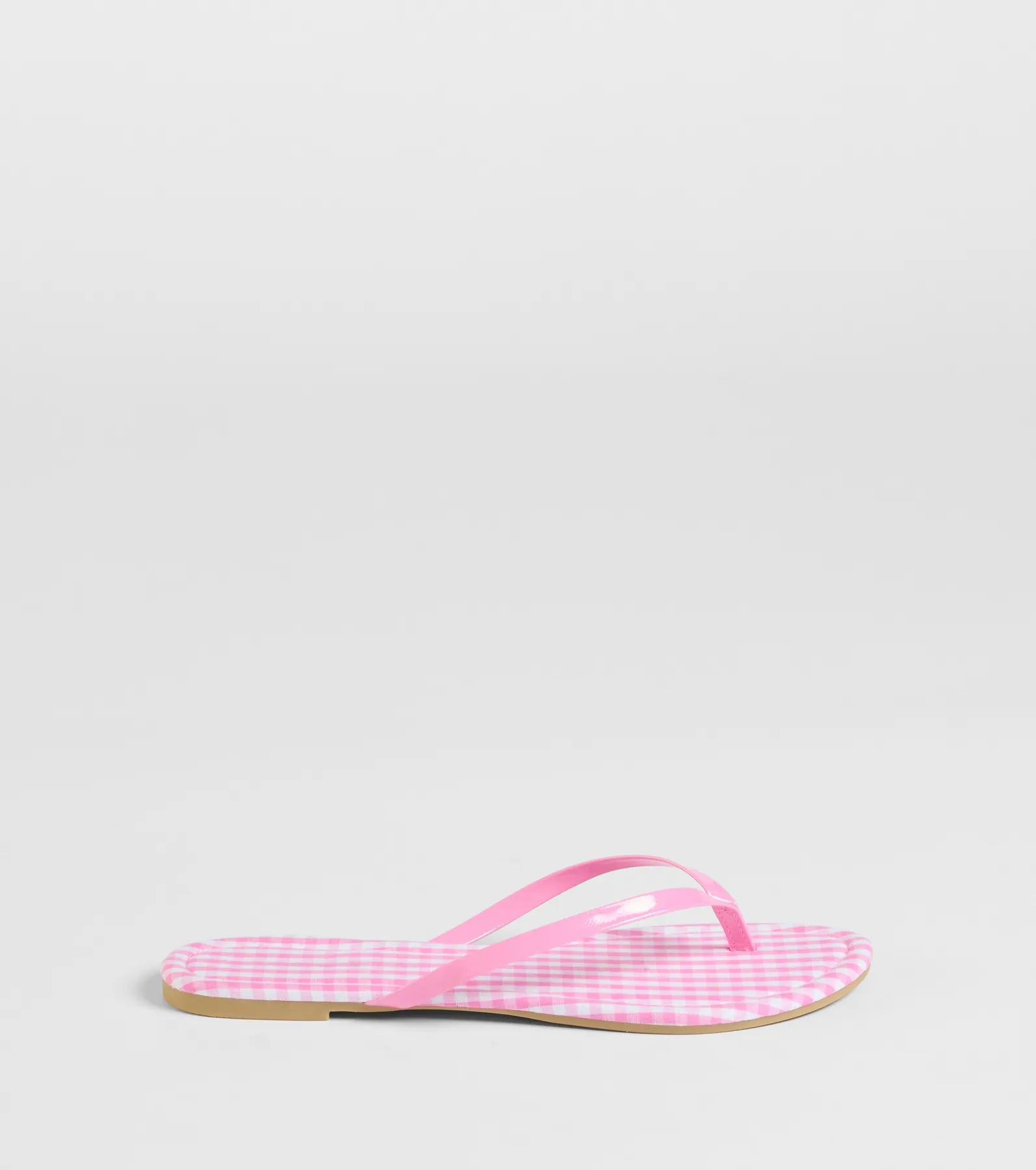 Elevate warm-weather looks with Cutie Vibe Gingham Print Thong Strap Sandals in pink, a pair of trendy sandals bringing chic, modern flair to every step.