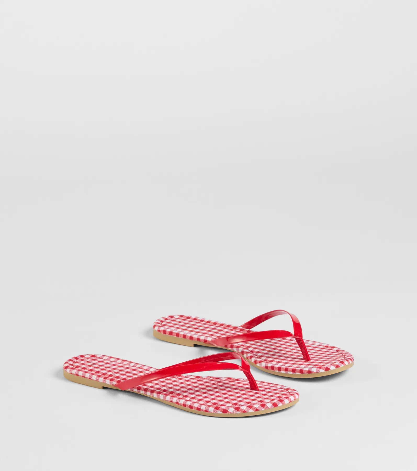 Style made simple with the Cutie Vibe Gingham Print Thong Strap Sandals in red, trendy women’s shoes that take your outfit from basic to bold in one step.
