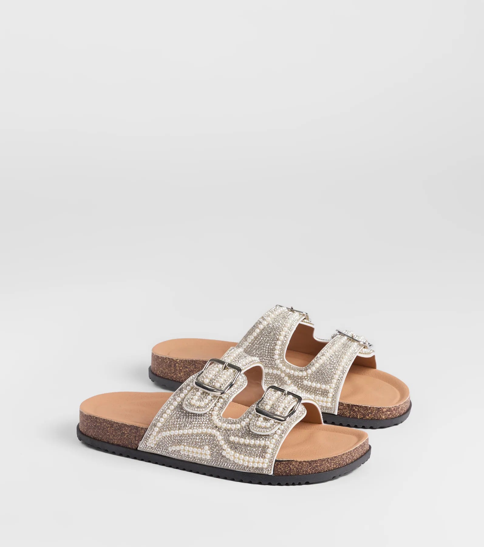 Style made simple with the Pretty Glam Rhinestone Pearl Buckle Slide Sandals in white, trendy women’s shoes that take your outfit from basic to bold in one step.