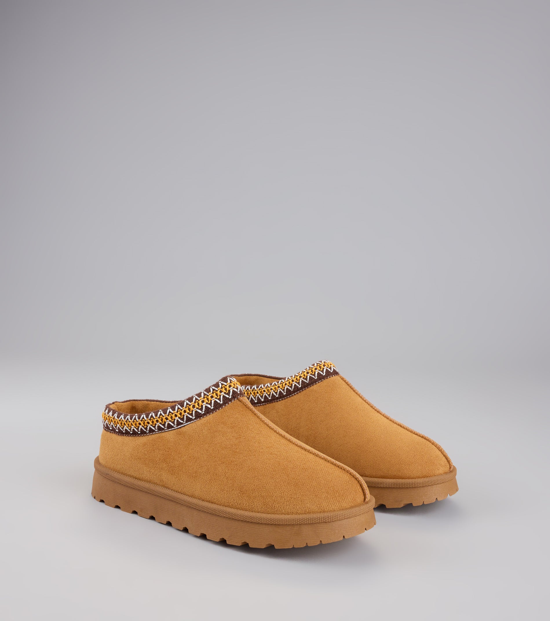 Style made simple with the Cozy Status Faux Suede Platform Slippers in tan, trendy women’s shoes that take your outfit from basic to bold in one step.