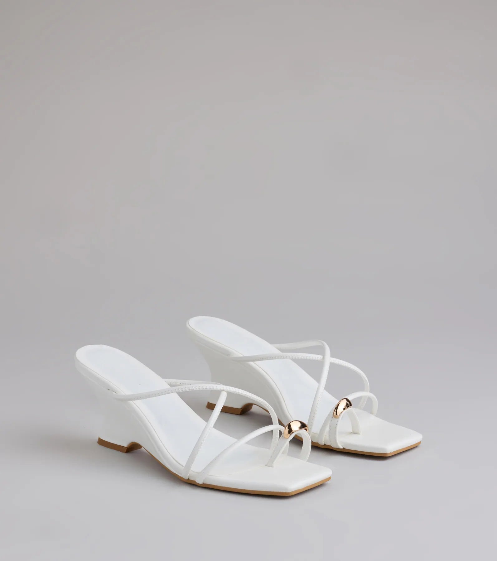 Style made simple with the Refined And Classy Toe Ring Strappy Wedges in white, trendy women’s shoes that take your outfit from basic to bold in one step.